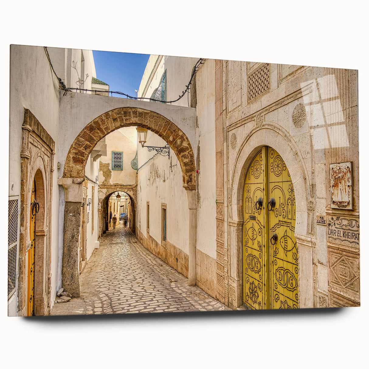 Large abstract wall art of a Tunisian landscape in muted earth tones on acrylic glass.