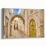 Framed canvas of a Tunisian landscape painting featuring vintage poster art style in colorful and black tones.