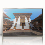 Mid-century modernist art of Bhutan scenery in silver framed acrylic, featuring muted earth tones.