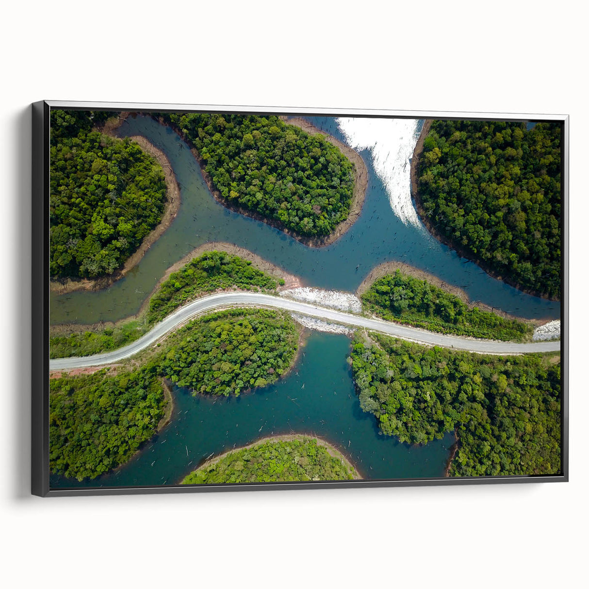 Black and white wall art featuring a vintage poster art style landscape of Laos, displayed on framed canvas.