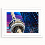 Abstract art print of Ontario scenery in muted blue and green tones, framed with a white mat.