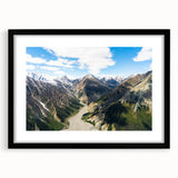 Extra large abstract art print of Yukon scenery in vibrant colors on a textured canvas, framed in black.