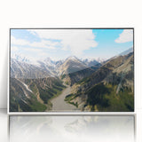 Acrylic print of a Yukon, Canada scenery in art deco style, with muted earth tones, framed in white.