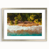 Extra large abstract art print of a Caribbean scene in textured tones of blue and green, framed with a silver mat.