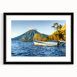 Abstract art print of Central American scenery in muted earth tones, framed with a black mat, suitable for dining room decor.
