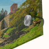 Large abstract wall art featuring a mid-century modernist design of Albanian scenery in muted earth tones on acrylic glass.