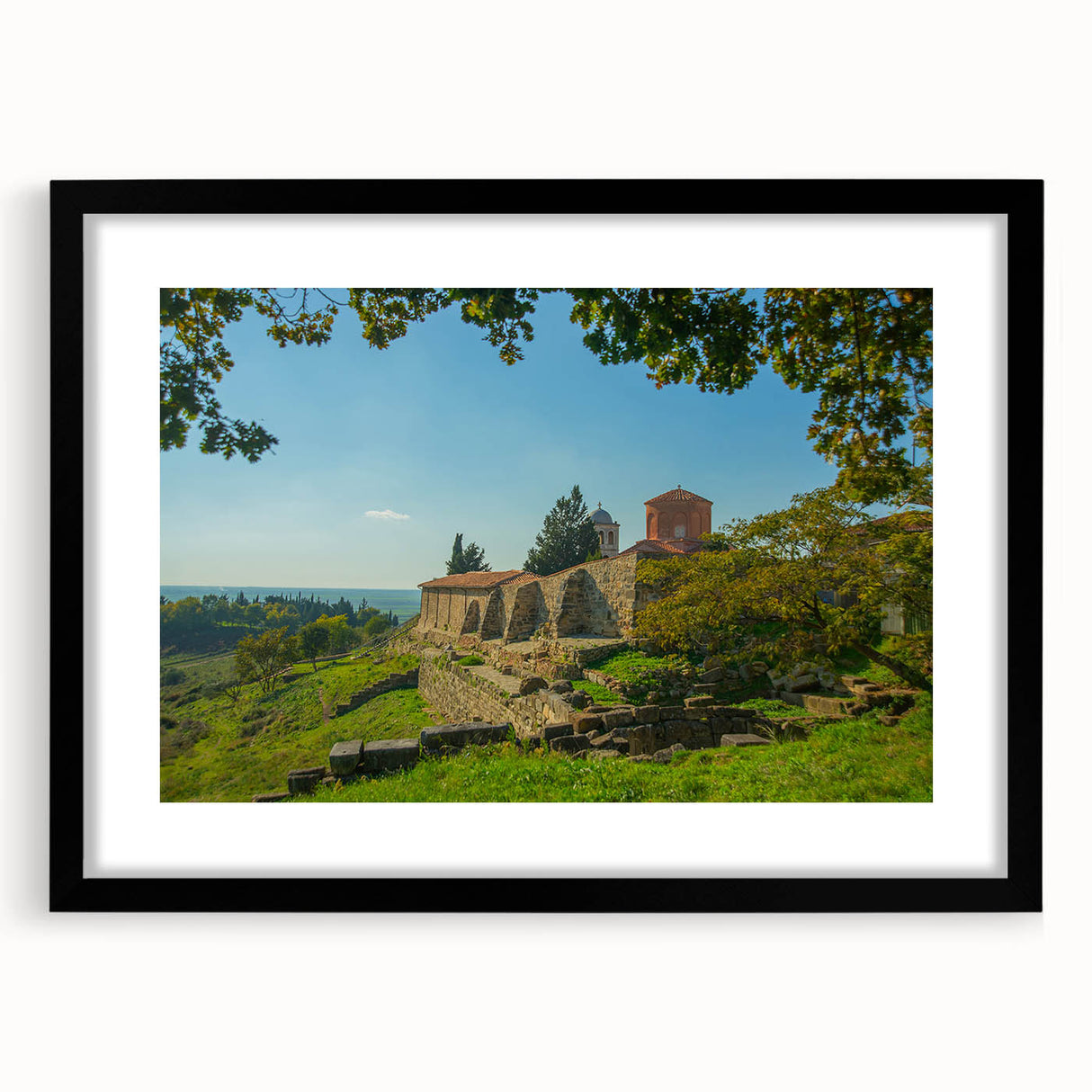 Colorful abstract art print of a European scenery in vibrant hues on a textured, extra large canvas, framed in black.