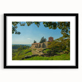 Colorful abstract art print of a European scenery in vibrant hues on a textured, extra large canvas, framed in black.