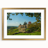 Extra large abstract art print of a European scenery in gold frame with mat, featuring textured elements in earth tones.
