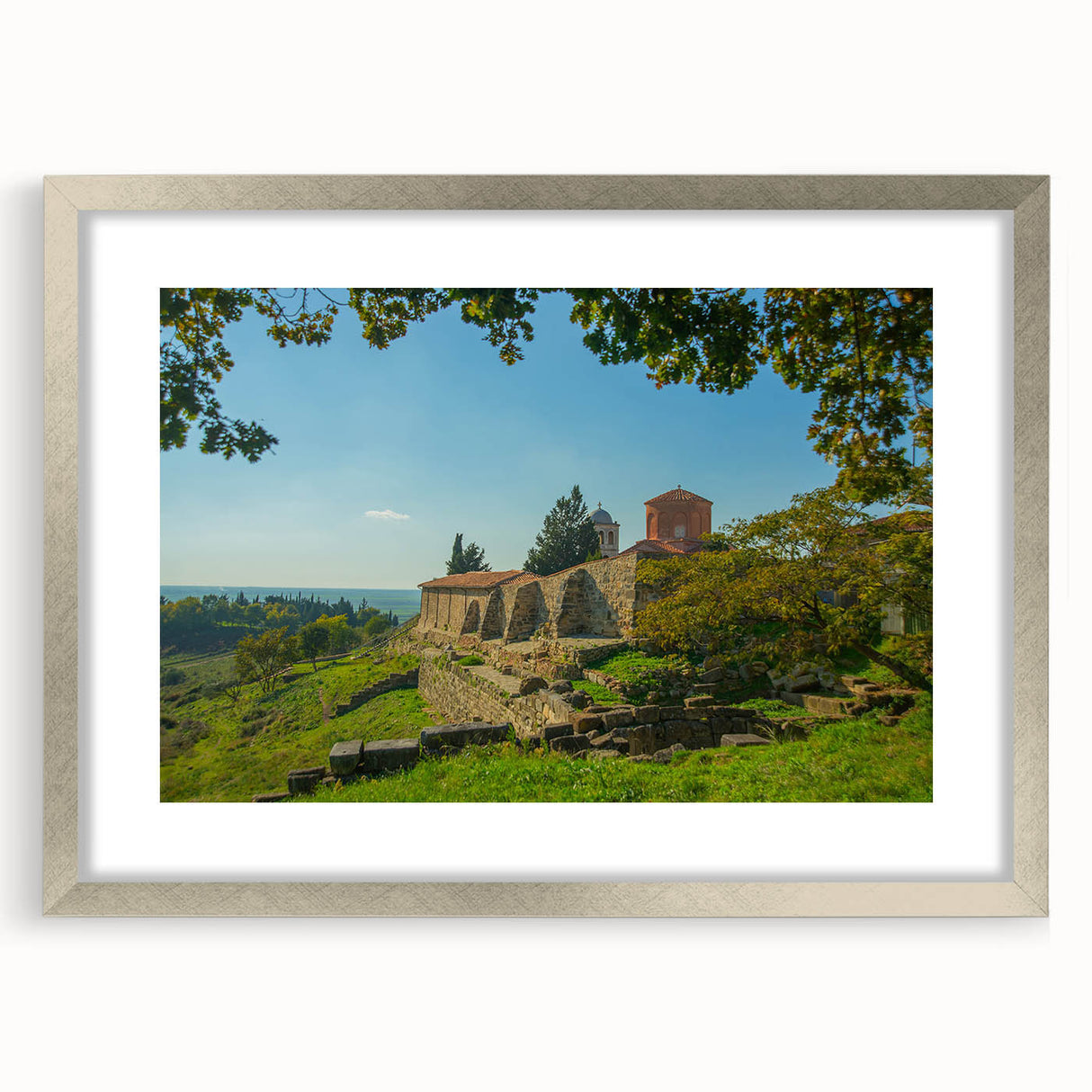Textured abstract art print of a European scenery in muted earth tones on a framed silver mat, suitable for bedroom art.