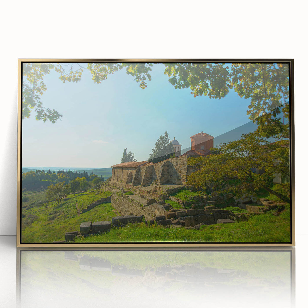 Art deco poster of an Albanian landscape, featuring gold and green tones on a framed acrylic.