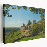 Large art depicting a serene Albanian landscape on stretched canvas, with soft green and blue tones.