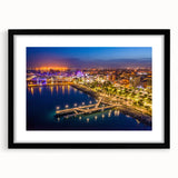 Extra large abstract art print of a colorful European scenery on a textured canvas, framed in black.