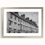 Extra large abstract art print of a European scenery in bath, displayed in a silver frame with mat.