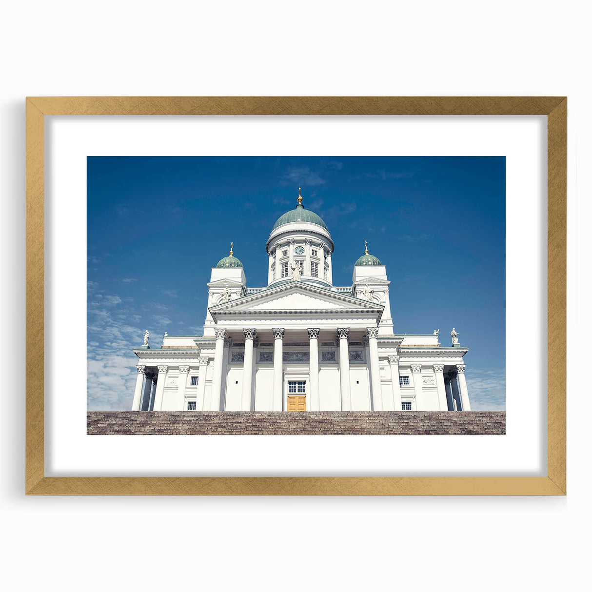 Abstract art print of a serene Finnish landscape in muted blue and green tones, framed in gold.