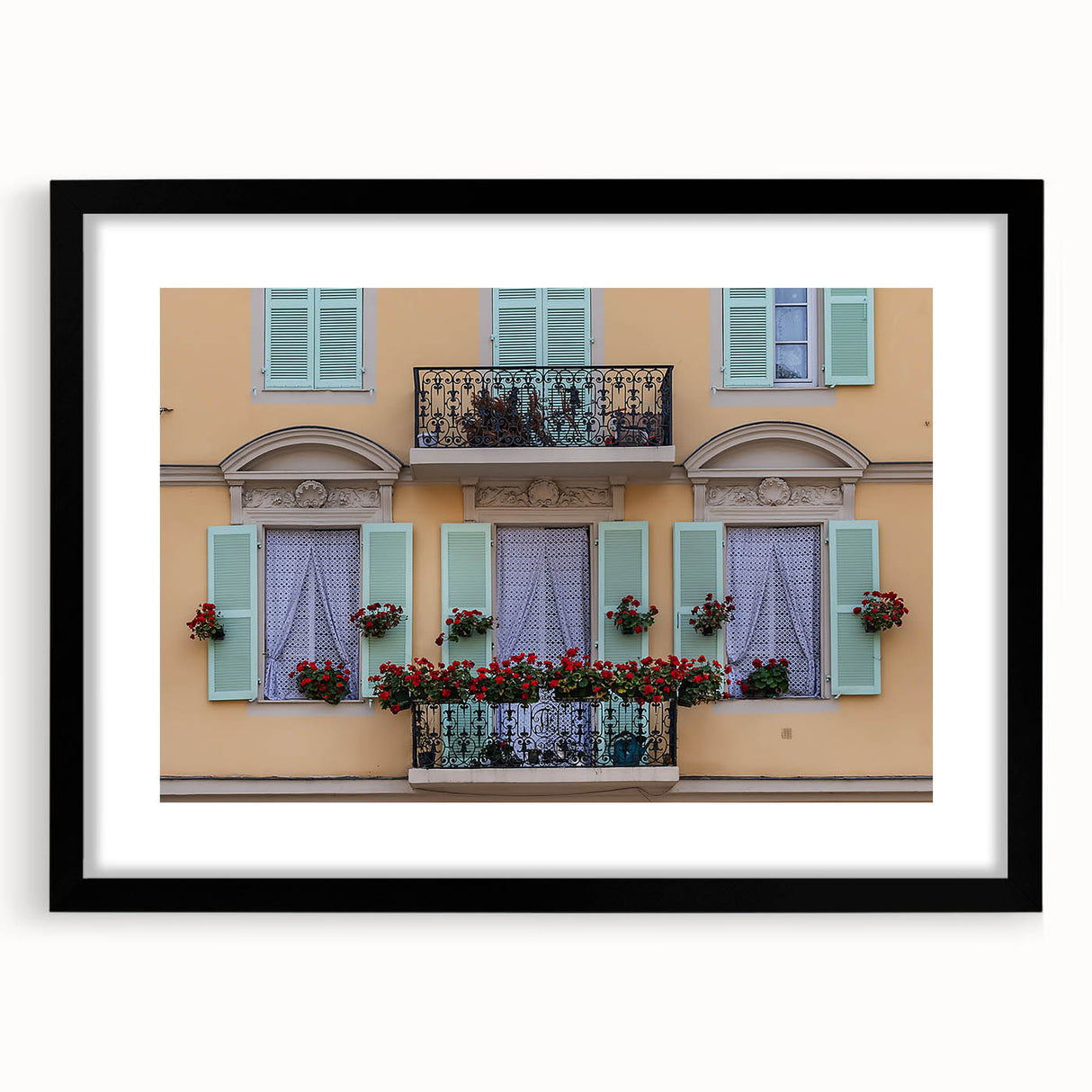 Extra large abstract art print of a colorful European scenery, textured finish, framed in black.