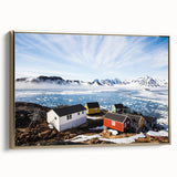Framed canvas wall art featuring a vintage-style landscape painting of Greenland, with muted green and black tones.