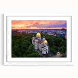 Textured abstract art print depicting a European landscape in muted earth tones, framed with a white mat.