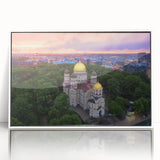 Mid-century modernist art depicting a serene European landscape in muted earth tones, acrylic print framed in white.