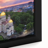 Extra large framed canvas of a textured, colorful European street scene in black with vibrant accents.