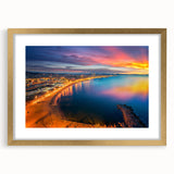 Abstract art print of Barcelona scenery in muted gold and blue tones on a framed canvas, suitable for dining room decor.