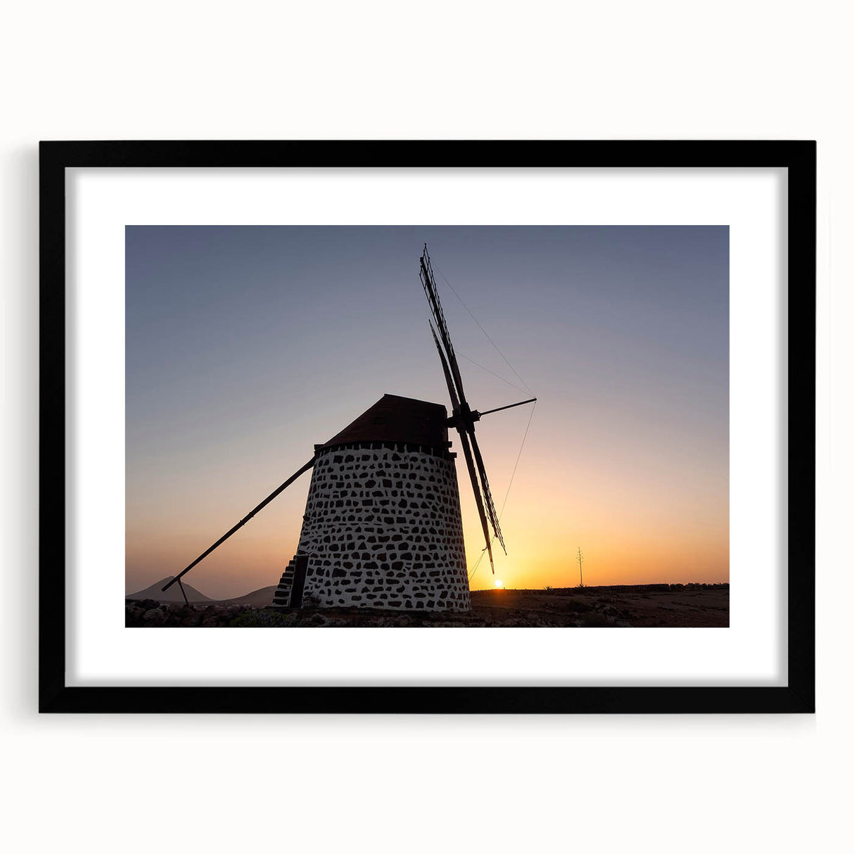 Extra large abstract art print of colorful, textured scenery of the Canary Islands, in a black frame with mat.