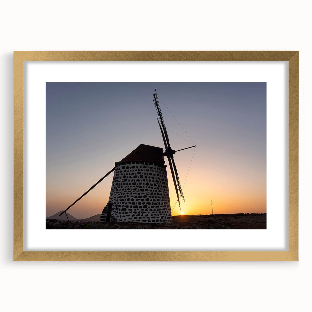 Abstract art print featuring soft pastel shades and fluid shapes on a framed canvas.