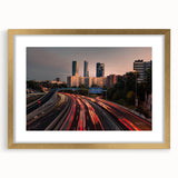 Extra large abstract art print of Madrid scenery in textured style, muted earth tones, framed in gold.