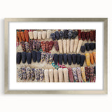 Textured art depicting abstract scenery of Oaxaca in muted earth tones, framed with a silver mat, suitable for bedroom decor.