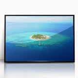 Large abstract wall art depicting a serene Fiji seascape in muted blue and green tones, framed in black acrylic.