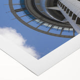 Art deco poster of Auckland skyline in muted blue tones, printed on rolled canvas, suitable for dining room decor.