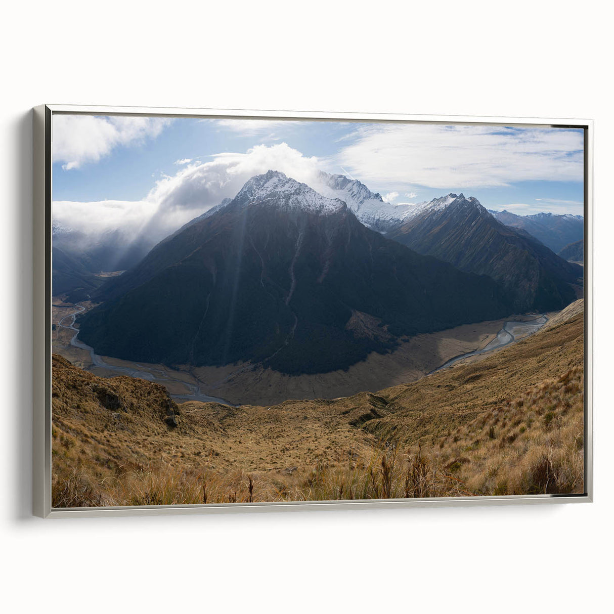 Framed canvas featuring a landscape art painting of Otago, New Zealand with colorful skies and black foreground.