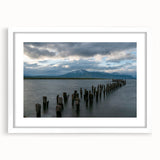 Abstract art print of Santiago skyline in muted earth tones, framed in white, suitable for dining room decor.