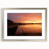 Textured art print depicting abstract Alabama scenery in muted earth tones, framed in silver, suitable for bedroom decor.