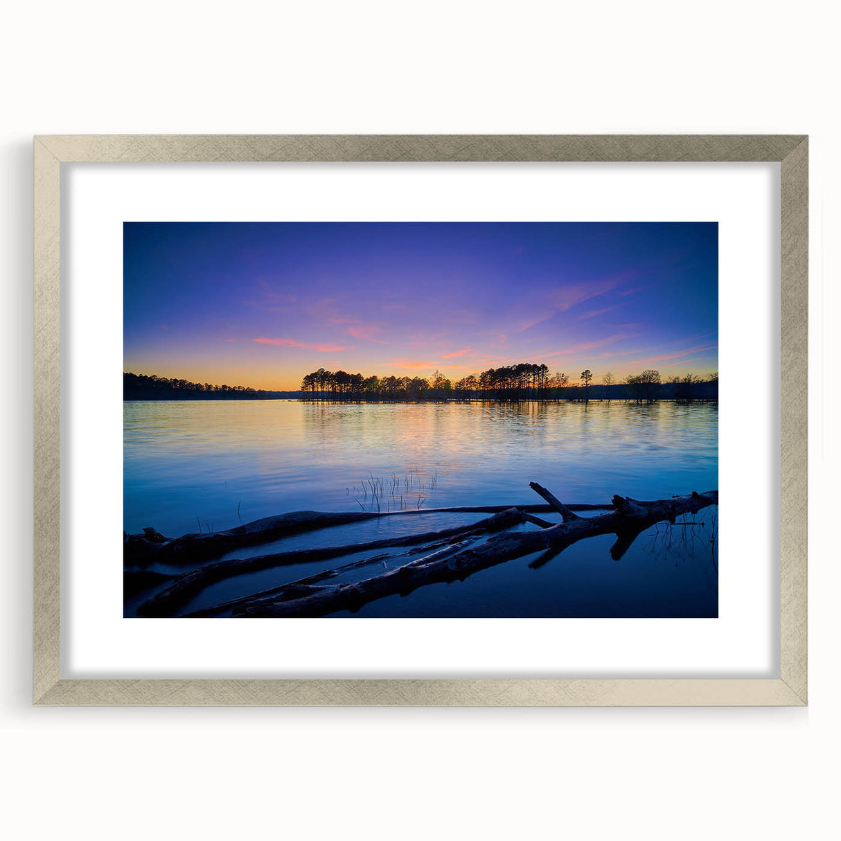 Textured art of abstract Arkansas scenery in muted earth tones on a framed silver mat, ideal for bedroom decor.