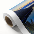 Art Deco style poster of Lake Tahoe with vibrant blue and green tones on a rolled canvas.
