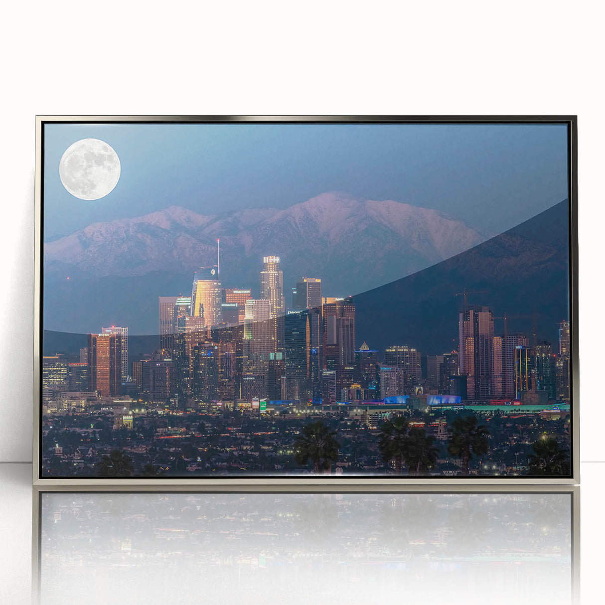 Mid-century modernist art depicting Los Angeles skyline in muted colors on a silver-framed acrylic.