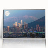Acrylic print of Los Angeles skyline in art deco style with muted pastel palette, framed in white.