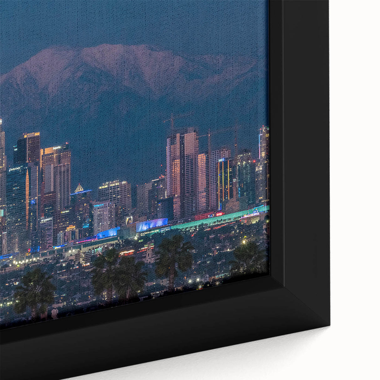 Close-up of extra large framed canvas featuring a textured, colorful Los Angeles skyline on a black background.