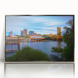 Mid-century modernist art of Sacramento skyline in muted blue and silver hues on a framed acrylic.