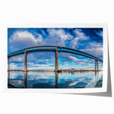 Extra large wall art depicting the San Diego skyline in muted gray and blue tones on a rolled canvas.