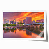 Rolled print of a serene Connecticut landscape with soft floral elements in muted green and blue tones.