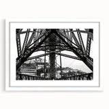 Abstract art print of New Orleans skyline in muted blues and grays on a white framed canvas.