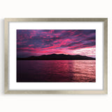 Textured art depicting an abstract landscape in muted grays and blues, framed in silver, ideal for bedroom wall decor.