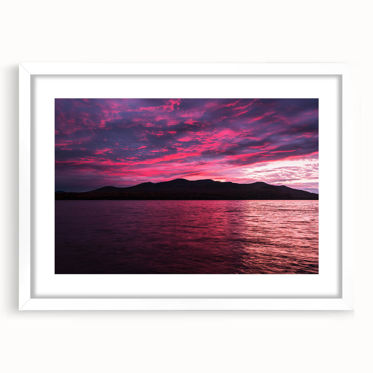 Abstract art print of Maine's scenery in muted blue and green tones on a white framed canvas, suitable for dining room decor.