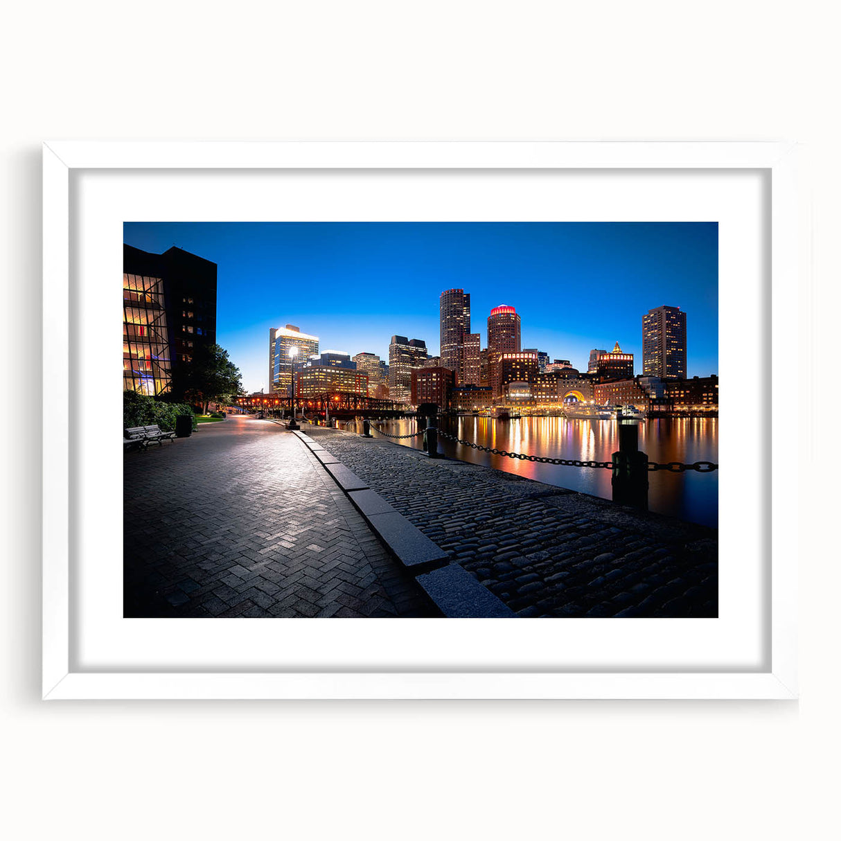 Abstract art print of Boston skyline in muted gray and blue tones, framed with a white mat, suitable for dining room decor.