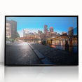 Large abstract wall art depicting the Boston skyline in muted gray and blue tones, framed in black acrylic.