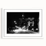 Abstract art print of Detroit skyline in muted gray and blue tones, framed with a white mat.