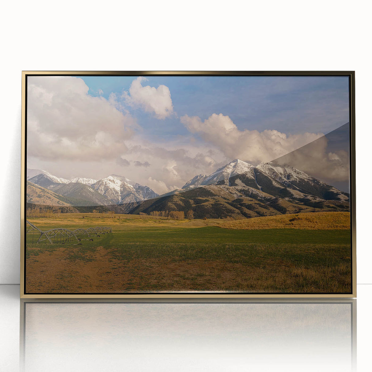 Mid-century modernist landscape of Montana scenery in gold and green tones on a framed acrylic print.