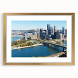 Abstract art print of Pittsburgh skyline in textured tones on a large framed canvas, ideal for living room decor.